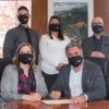 Oshawa Power executive team signing document